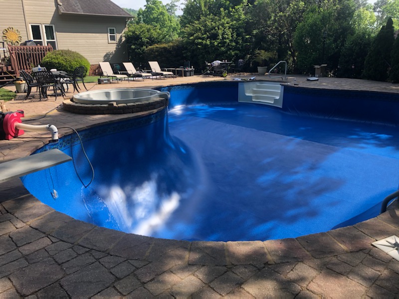 New vinyl liner being installed in a freeform pool by Clear H2O Auburn